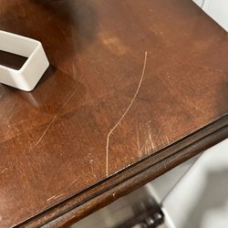 Aggieland Moving - scratched TV stand.