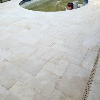 Stone-Mart - a pool in the middle of a patio - Building Supplies Near Me - Tampa, Florida