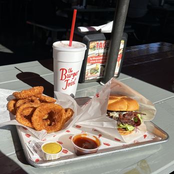 The Burger Joint - Montrose - Blue Cheese Steak Burger, Onion Rings, BBQ Sauce side - Burgers Near Me - Houston, Texas The Burger Joint - Montrose - Blue Cheese Steak Burger, Onion Rings, BBQ Sauce side - Burgers Near Me - Houston, Texas