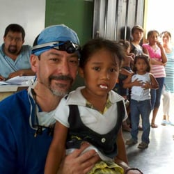 Old Orchard Periodontics & Implant Dentistry - Dr. Barack performing charitable dental procedures in Honduras