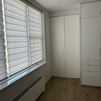 AR Woodworking - a room with a window and a radiator - General Contractors Near Me