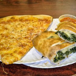 Jack's Pizzeria - 2-18-26. Regular slice and a spinach roll.