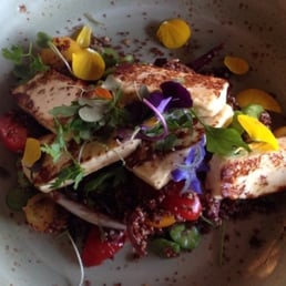 Grilled halloumi cheese salad, red quinoa, broad beans, zaatar and cherry tomatoes
