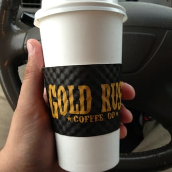 Gold Rush Coffee - a hand holding a coffee cup - Coffee & Tea Near Me - McMinnville, Oregon Gold Rush Coffee - a hand holding a coffee cup - Coffee & Tea Near Me - McMinnville, Oregon