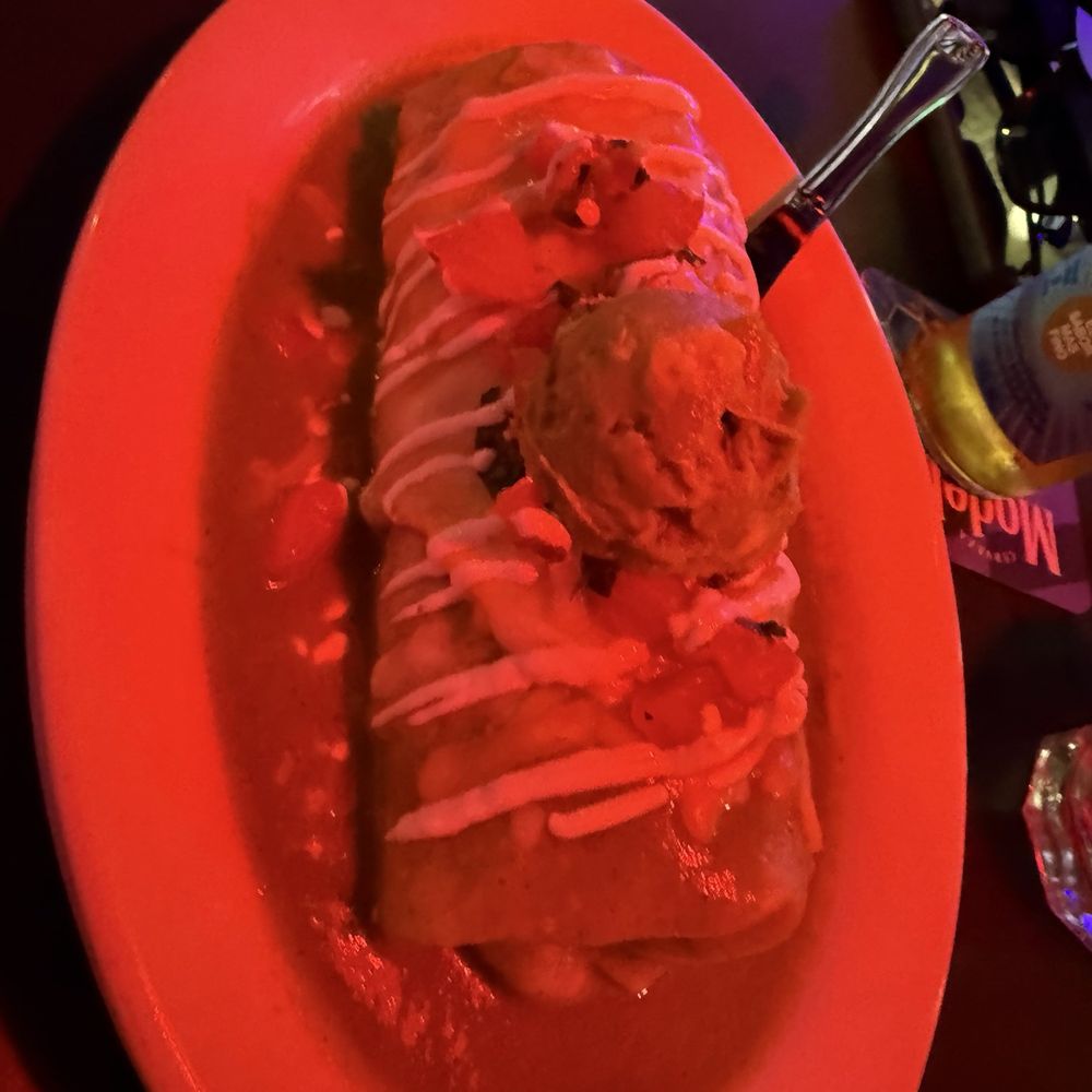 Villa Escondida Restaurant and Bar - Wet burrito (green sauce but the red light above us doesn't help with the photo) - Mexican Near Me - Seattle, Washington Villa Escondida Restaurant and Bar - Wet burrito (green sauce but the red light above us doesn't help with the photo) - Mexican Near Me - Seattle, Washington