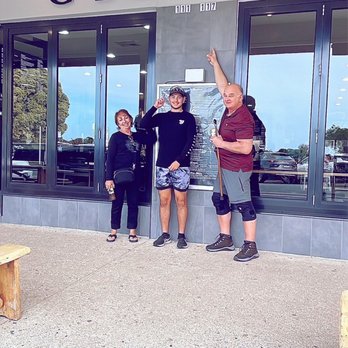 George's Takeaway - Grandson of owner outside Greek  family restaurant in Apollo Bay in Victoria Australia - Seafood Near Me - Apollo Bay, VIC