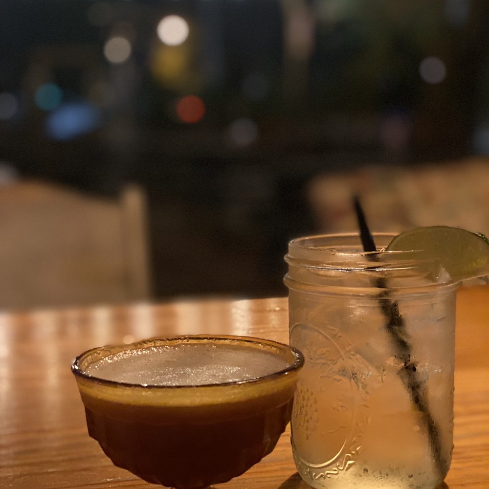 ShopBar - a mason jar and a drink on a table - Bars Near Me - Louisville, Kentucky ShopBar - a mason jar and a drink on a table - Bars Near Me - Louisville, Kentucky