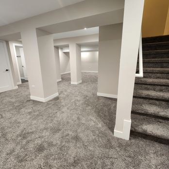 GZ Developments - a basement with carpet and stairs - Drywall Installation & Repair Near Me - Chicago, Illinois
