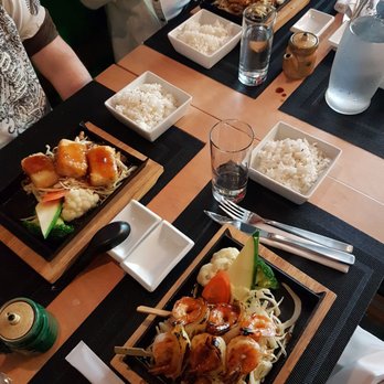Kasumi - people sitting at a table with plates of food - Sushi Bars Near Me - Montreal, Quebec