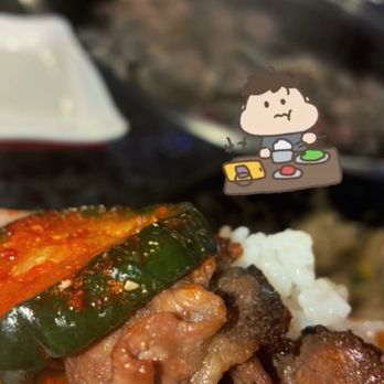 Road to Seoul BBQ - Best bite: rice, cucumber kimchi, bulgolgi, over rice paper - Korean Near Me - Alhambra, California
