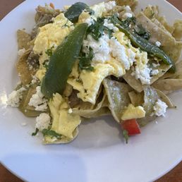Chilaquiles with verde sauce and scrambled eggs. Spicy and very filling! Hubby took half home for leftovers! Chilaquiles with verde sauce and scrambled eggs. Spicy and very filling! Hubby took half home for leftovers!