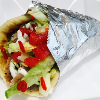 Gyro Cafe - Give the traditional shaved roast lamb & beef gyro a kick with a little Sriracha sauce! - Greek Near Me - Alpharetta, Georgia Gyro Cafe - Give the traditional shaved roast lamb & beef gyro a kick with a little Sriracha sauce! - Greek Near Me - Alpharetta, Georgia
