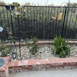 His crew replaced the flower beds with rock and planted and replanted flowers and changed out the drip system. It's so clean!