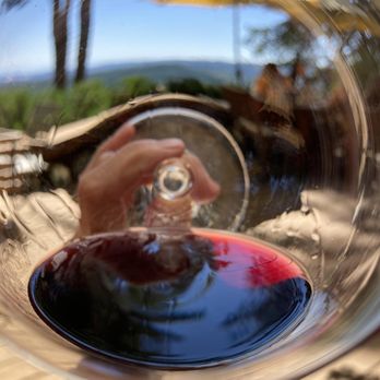 Six Peaks Winery - a person holding a glass of wine - Wineries Near Me - Hillsboro, Oregon Six Peaks Winery - a person holding a glass of wine - Wineries Near Me - Hillsboro, Oregon