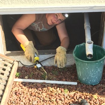 Kannon Construction - a woman fixing a window - General Contractors Near Me Kannon Construction - a woman fixing a window - General Contractors Near Me