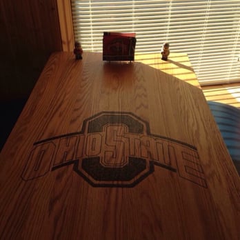 Classics Sports Bar - a wooden table with a logo on it - Sports Bars Near Me - Pickerington, Ohio Classics Sports Bar - a wooden table with a logo on it - Sports Bars Near Me - Pickerington, Ohio