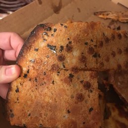 Bottom of my pizza has pieces of pizza pan on it. This is horrible.