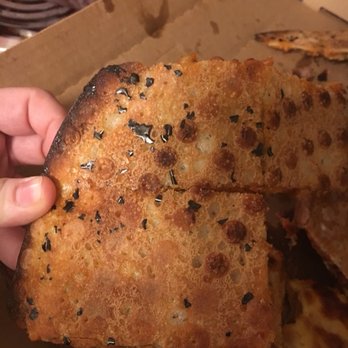 Red's Savoy Pizza - Bottom of my pizza has pieces of pizza pan on it. This is horrible. - Pizza Near Me - Saint Louis Park, Minnesota