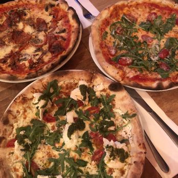 Pizzeria Tuscolo - three pizzas on a table - Italian Near Me - Montreal, Quebec Pizzeria Tuscolo - three pizzas on a table - Italian Near Me - Montreal, Quebec