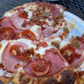 Whitewater Pizza Co. - Meat Lovers - one of us couldn't wait for the photo! Lol. - Pizza Near Me - Lotus, California Whitewater Pizza Co. - Meat Lovers - one of us couldn't wait for the photo! Lol. - Pizza Near Me - Lotus, California