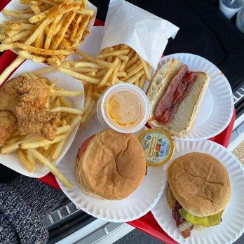 Zac's - a tray of food including a hot dog, fries, and a sandwich - Burgers Near Me - Aston, Pennsylvania