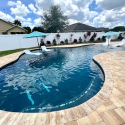 Home and Pool Pros - Beach entry pool with sunshelf and pool bench. Everyone needs a beach int heir backyard-This is Florida.