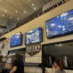 The Pantown Brewing Company - Front counter with a bunch of awesome growlers atop from around the nation! Brought in by various folks!