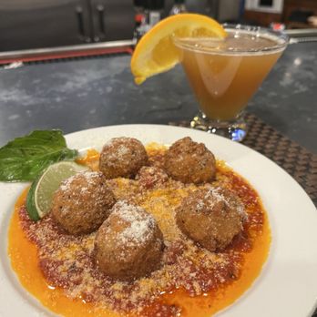 Phillips Seafood - Risotto crab balls with marinara sauce and cheese. Accompanied with a cognac SIDECAR - Seafood Near Me - Baltimore, Maryland Phillips Seafood - Risotto crab balls with marinara sauce and cheese. Accompanied with a cognac SIDECAR - Seafood Near Me - Baltimore, Maryland