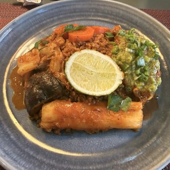 Bintü Atelier - Thieboudieun. Grouper is under the green sauce for reference. - African Near Me - Charleston, South Carolina Bintü Atelier - Thieboudieun. Grouper is under the green sauce for reference. - African Near Me - Charleston, South Carolina