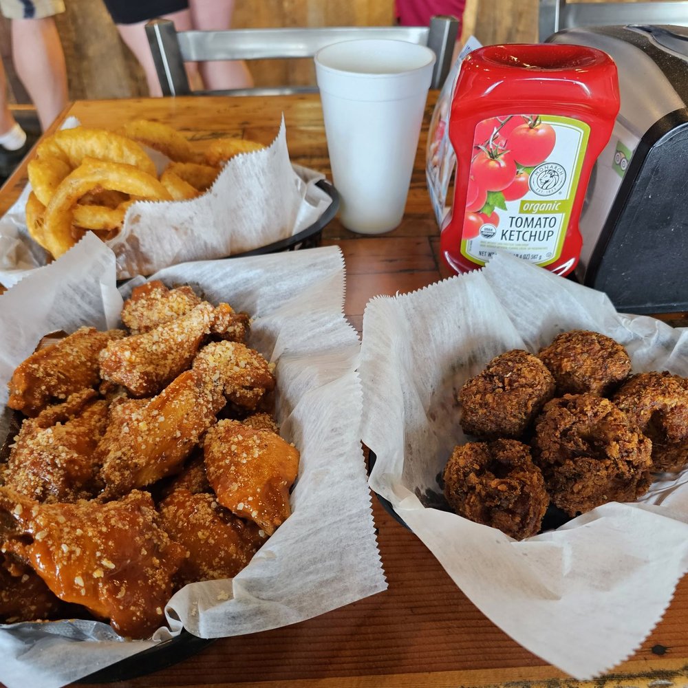 Spicy garlic parm wings, Mac n cheese balls, onion rings Spicy garlic parm wings, Mac n cheese balls, onion rings