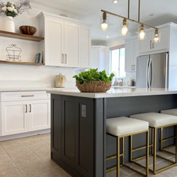 Island Contractors - Our Kapolei remodeled kitchen. Removed the outdated cherry cabinets and added an island and floating shelves! They loved how it came out!