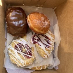 By The Dozen Bakery - Harvard - Good European style donuts and pastry. Raspberry filled sugar. Cream filled Bismarck. Cherry and raspberry and apple danish