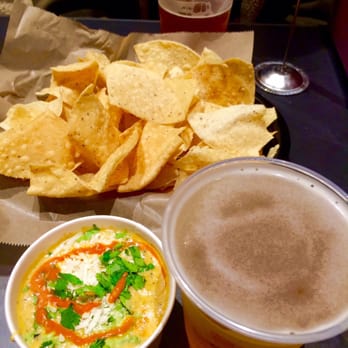 Torchy's Tacos - Green chile queso and chips with Pearl Snap IPA - Tex-Mex Near Me - Austin, Texas Torchy's Tacos - Green chile queso and chips with Pearl Snap IPA - Tex-Mex Near Me - Austin, Texas