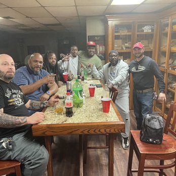 River City Cigars & Brew - a group of men sitting around a table - Cigar Bars Near Me - Vicksburg, Mississippi