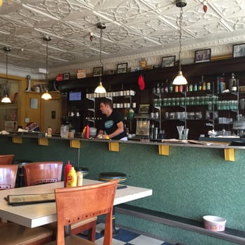 Hali Deli - a man standing at the counter - Delicatessen Near Me - Halifax, Nova Scotia