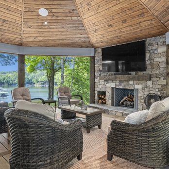 Cornerstone Construction - Custom built outdoor living space with fireplace and floor to ceiling views of Smith Lake. - General Contractors Near Me - Arley, Alabama Cornerstone Construction - Custom built outdoor living space with fireplace and floor to ceiling views of Smith Lake. - General Contractors Near Me - Arley, Alabama