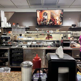 Omega House - View of kitchen from counter seats - Burgers Near Me - Winston Salem, North Carolina Omega House - View of kitchen from counter seats - Burgers Near Me - Winston Salem, North Carolina