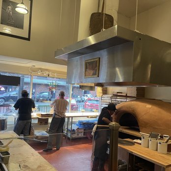 APizza Little Italy - Making pizza with clay oven in back - Pizza Near Me - Tacoma, Washington