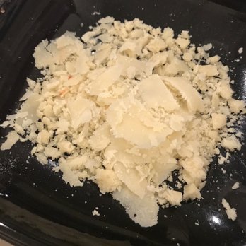 Cozymeal - Italian Parmesan to top the pizza....yum - Cooking Classes Near Me - San Francisco, California