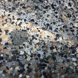 Here is a chunk of my pebble tec from underneath the deck, sitting on an area that Matt did poorly. Notice the difference in color.