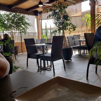 Hapy Bistro - Outdoor dining area, complete with overhead heaters.  Wonderfully cozy. - Mediterranean Near Me - Pismo Beach, California