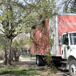Schneiderman's Furniture - Inappropriately large delivery vehicle in our drive tearing off a branch from our mature maple tree.