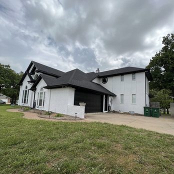 New Image Roofing and Construction - a white house with a black roof - Roofing Near Me - Burleson, Texas