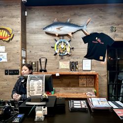 Feasty crab - The exit. Cute fish and Feasty Crab merchandise on the wall.