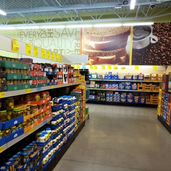 ALDI - a grocery store aisle filled with products - Fruits & Veggies Near Me - Owatonna, Minnesota