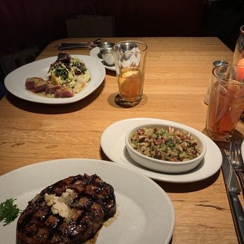 Hillstone - Hawaiian Ribeye with substituted dirty rice side; Seared Tuna Salad in the back of the photo. - Salad Near Me - Houston, Texas