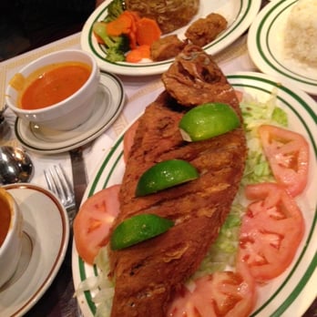 El Conuco Restaurante - Pargo frito; chicken mofongo in the back. - Dominican Near Me - Union City, New Jersey