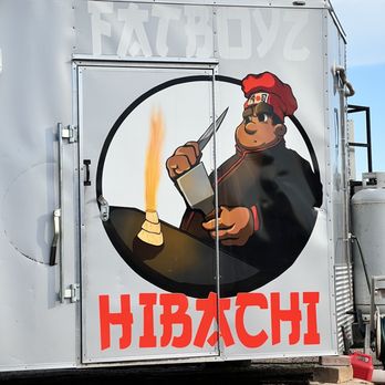 FatBoyz Hibachi - a man holding a lighter - Food Trucks Near Me - Austin, Texas