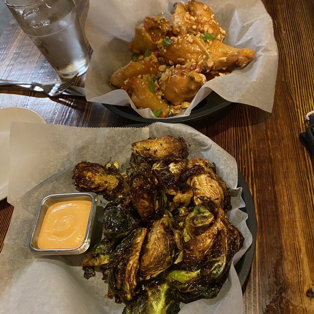 The Coop - charred Brussel sprouts and sweet 'n spicy chicken wings - Tapas Bars Near Me - Blacksburg, Virginia The Coop - charred Brussel sprouts and sweet 'n spicy chicken wings - Tapas Bars Near Me - Blacksburg, Virginia