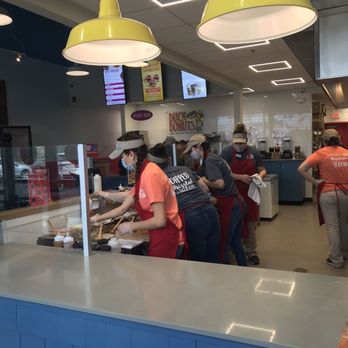 Duck Donuts - Workers hard at work making the donuts. - Donuts Near Me - Latham, New York Duck Donuts - Workers hard at work making the donuts. - Donuts Near Me - Latham, New York